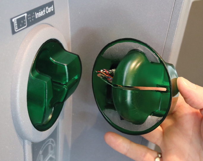 An image of ATM Card Skimmer detached from the genuine ATM Card Reader