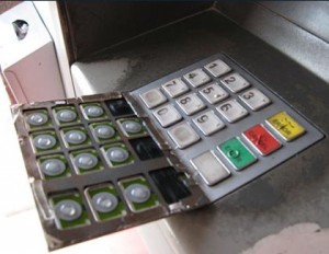 A layer of ATM Skimmer Pin Pad on top of the genuine Pin Pad
